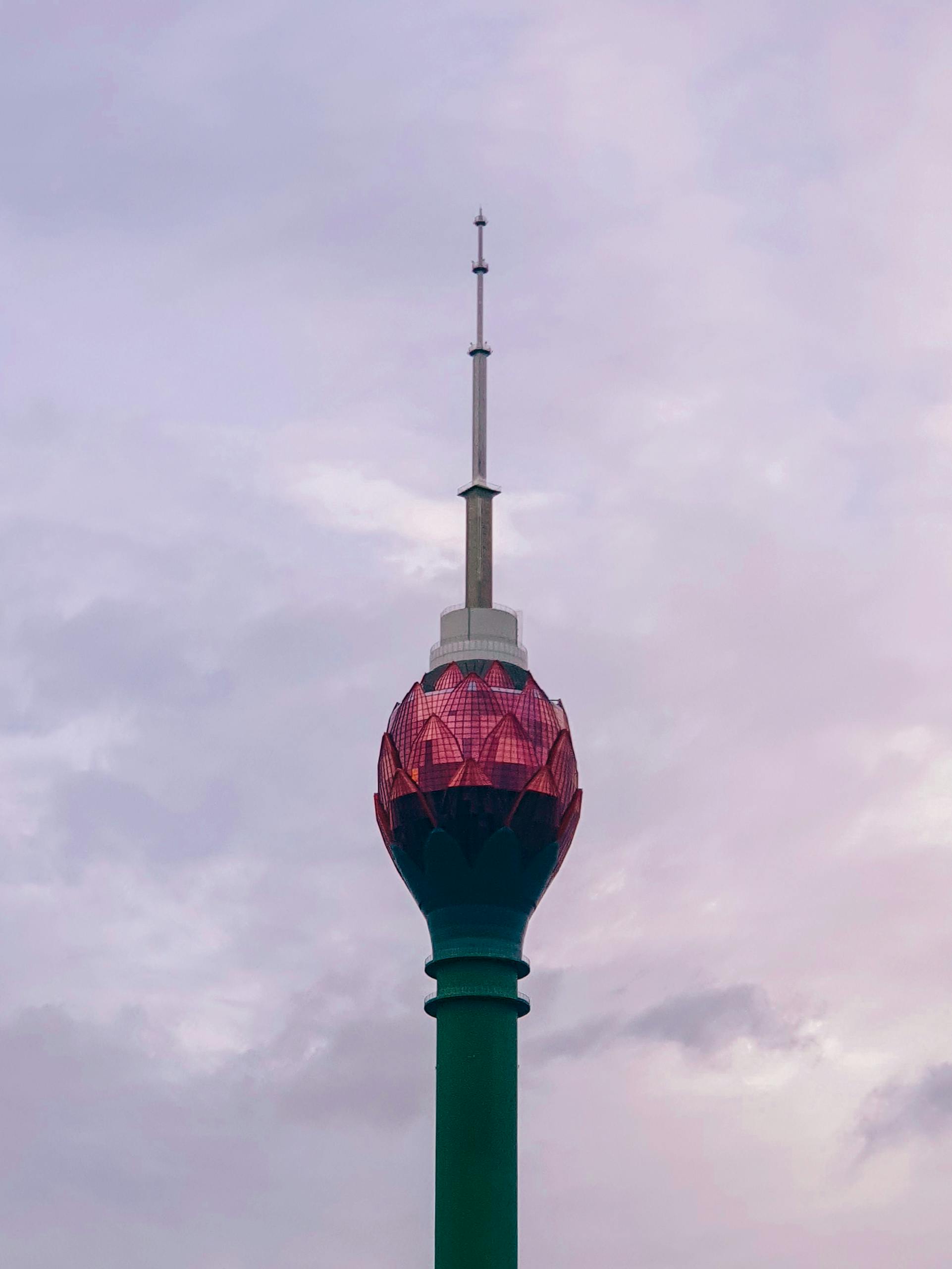 Captivating image of the Lotus Tower standing tall against a cloudy sky in Colombo, Sri Lanka.